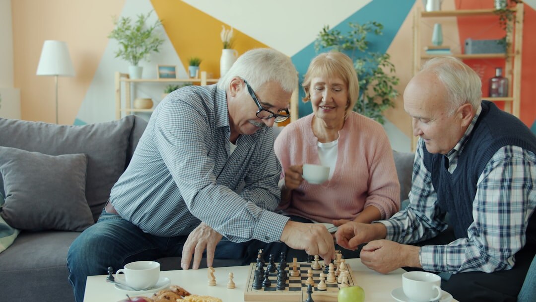 Group of seniors socializing at a community center table