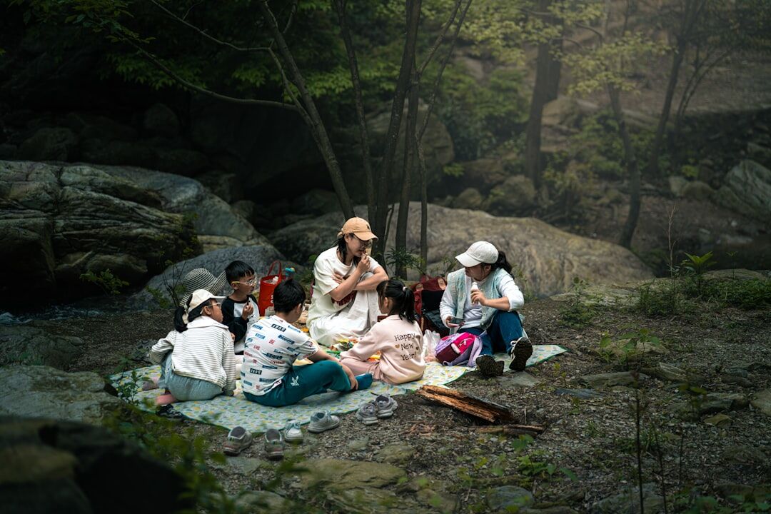 Group of senior friends enjoying a picnic outdoors